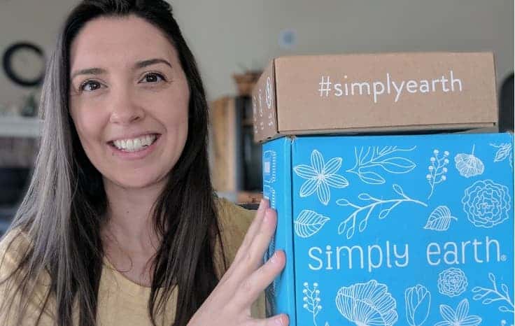 Jill holding Simply Earth Boxes for Simply Earth April 2019 Review Featured Image - Holding up Subscription boxes