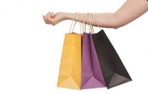 holding shopping bags
