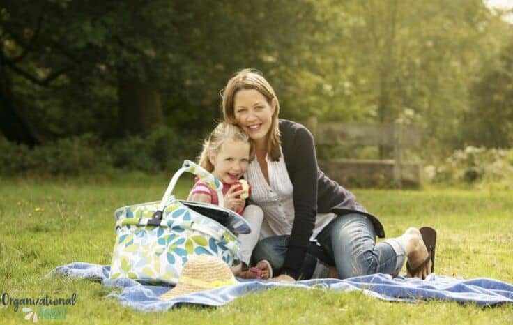 mother and daughter with picnic blanket